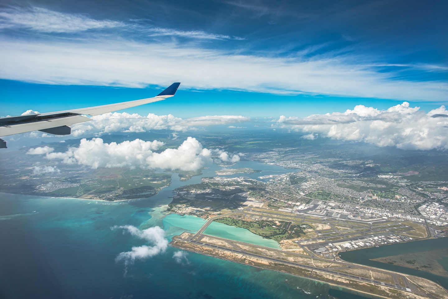 Aerial view from plane window over Hawaii coastline for inter-island day trips